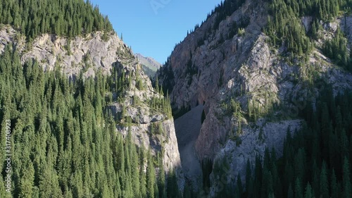 Kaindy lake and fir trees in the Kungei-Alatau mountains. The Northern Tien Shan. Kazakhstan. photo