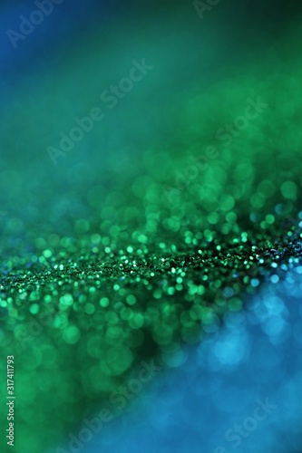 glitter background.blue and Green gloss layout. Green and blue striped glitter with shining bokeh.Vibrant background with twinkle lights. glitter brilliant mockup