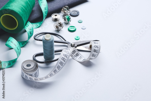 Fototapeta Naklejka Na Ścianę i Meble -  Set of tailor's supplies on white background