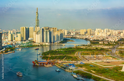 Aerial cityscape of Binh Thanh District in Ho Chi Minh City, where Landmark 81 skyscrapper is located. Photo is taken from Bitexco Tower. photo