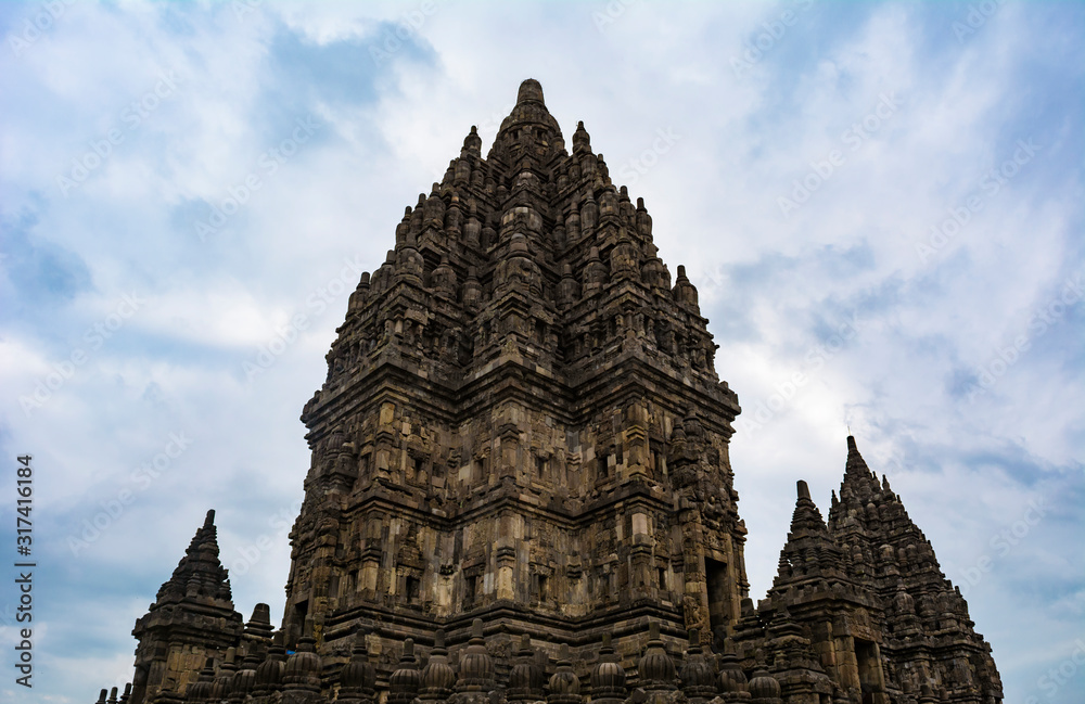 The temples in Prambanan Temple complex in the boundary between Klaten Regency and Yogyakarta Province in Java Island, Indonesia; taken at a cloudy afternoon.