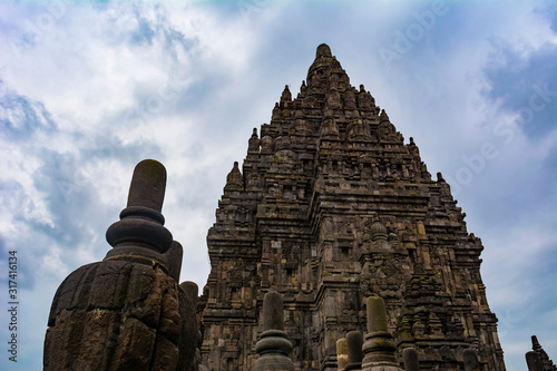 The temples in Prambanan Temple complex in the boundary between Klaten Regency and Yogyakarta Province in Java Island, Indonesia; taken at a cloudy afternoon. photo