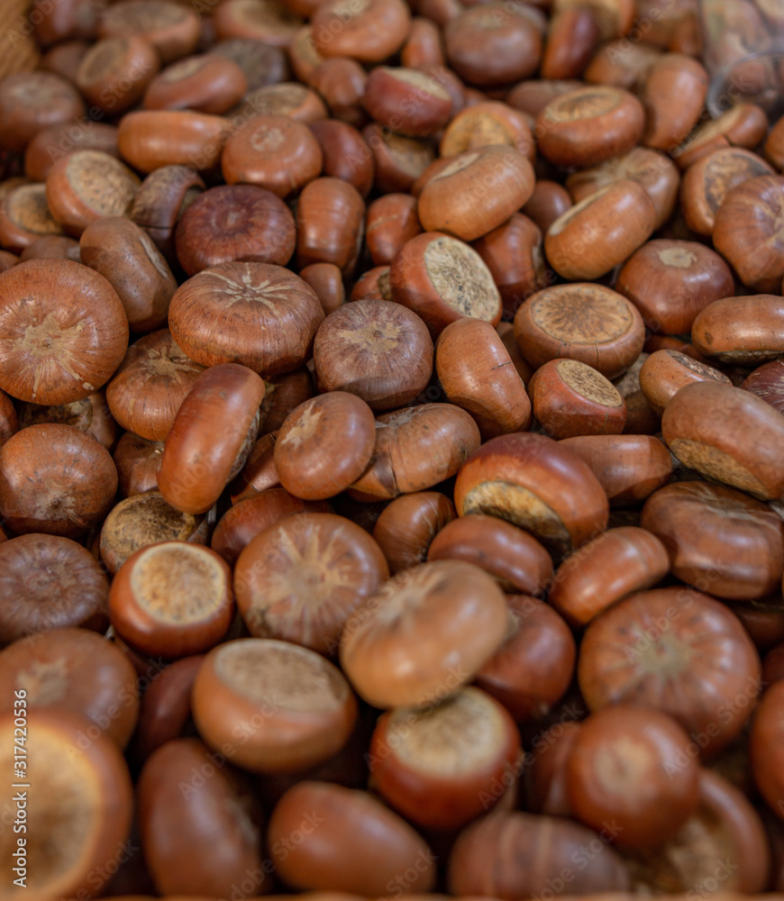 dry nuts of edible chestnuts as a background dry nuts of edible chestnuts as a background