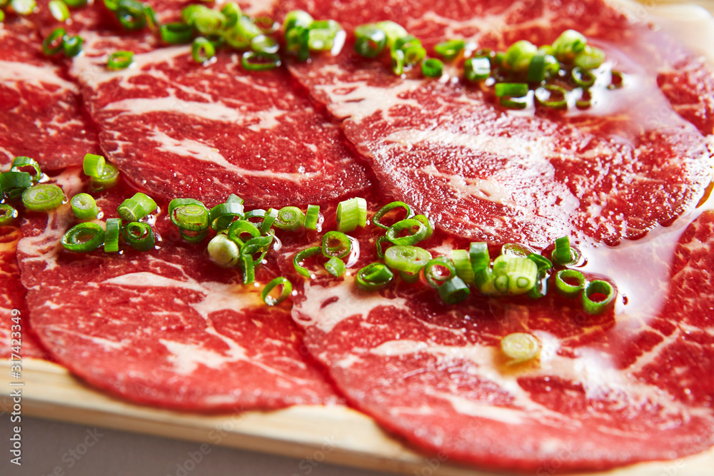 Yakiniku, thin sliced beef with scallion Yakiniku, thin sliced beef with scallion
