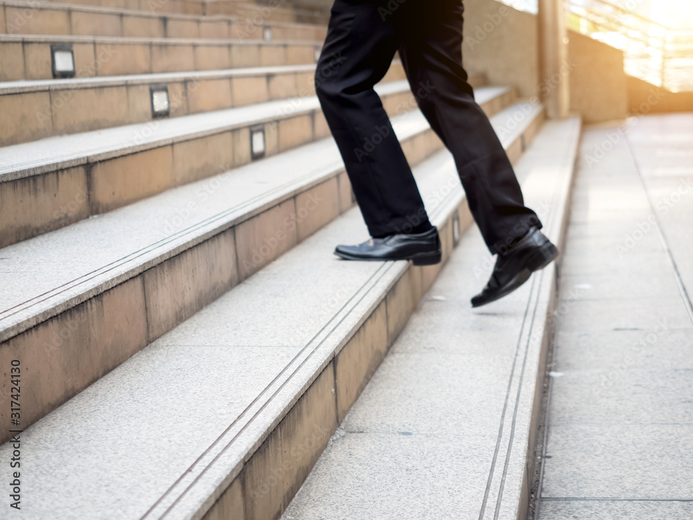 Businessman worker is two leg step leader way of forword action manager success professional occupation career executive Businessman worker is two leg step leader way of forword action manager success professional occupation career executive