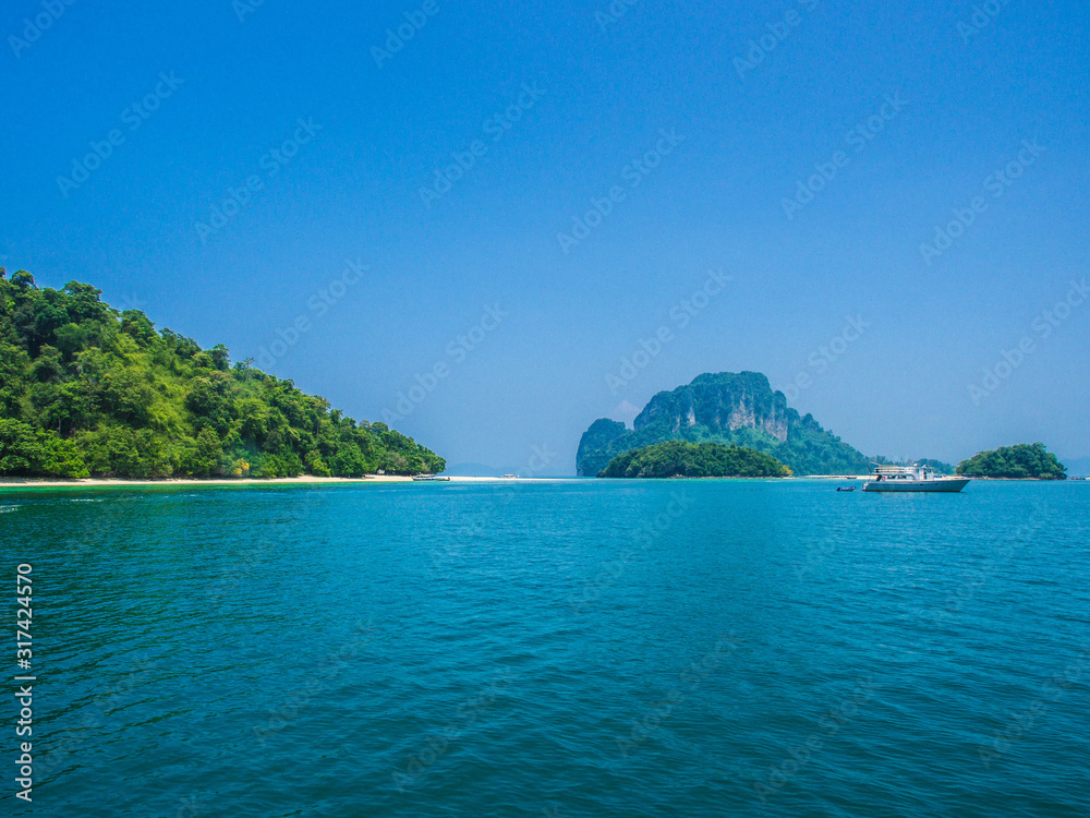 Fototapeta premium Asia Thailand have beach,sand,sun,sea and sky blue for summer vocation and travel relax holiday paradise landscape nature on the beautiful and There are many islands and floating boats.