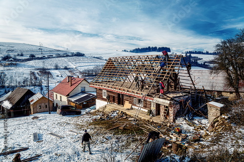 Pokryvac, Slovakia, January 2, 2020. Disassembling old wooden cottage, Orava wooden cottage. photo