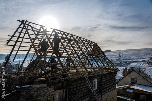 Pokryvac, Slovakia, January 2, 2020. Disassembling old wooden cottage, Orava wooden cottage. photo