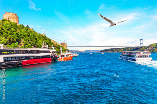 Ships in the Bosporus near the Sultan Fatih Mehmet Bridge and the Rumeli Hisar , Istanbul, Turkey