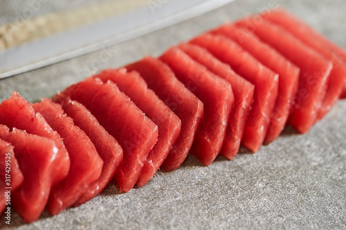 Sliced tuna with sashimi knife 