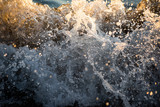 Abstract background with splashes on a pebble beach is close