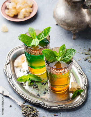 Mint tea, Moroccan traditional drink in glass. Close up. photo