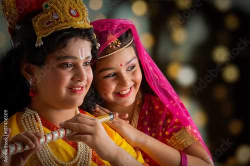 young radha and krishna smiling
