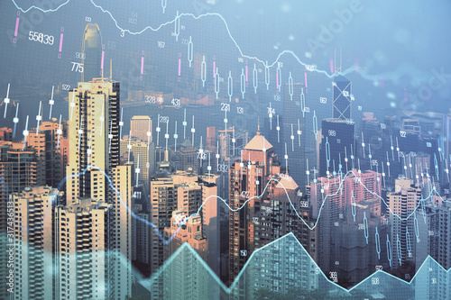 Forex graph on city view with skyscrapers background multi exposure. Financial analysis concept.