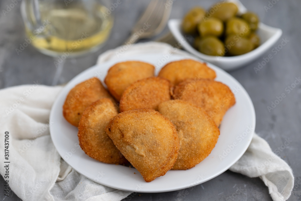 typical portuguese snack with meat rissois de carne on ceramic background typical portuguese snack with meat rissois de carne on ceramic background