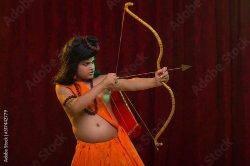 Fotografie lord rama killing with bow and arrow