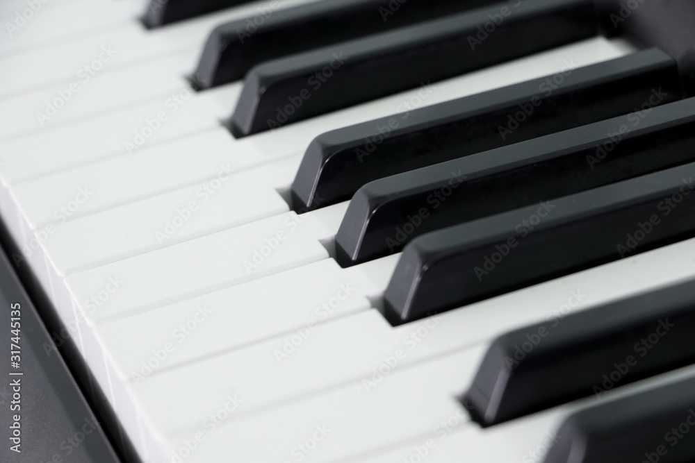 Classical piano keyboard selective focus.Piano keys musical instrument side view.Piano famous acoustic equipment Classical piano keyboard selective focus.Piano keys musical instrument side view.Piano famous acoustic equipment
