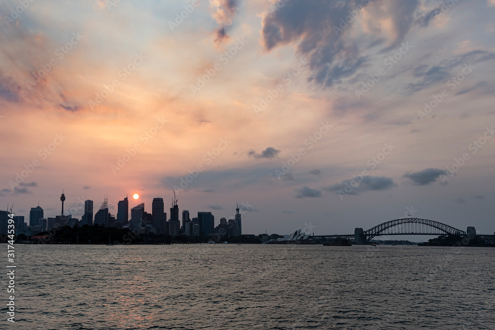 The famous Sydney skyline seen across the harbour at dusk