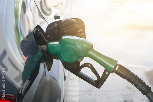 Petroleum Gas station. Fuel pump colorful petrol pump filling nozzles.car at gas station being filled with fuel