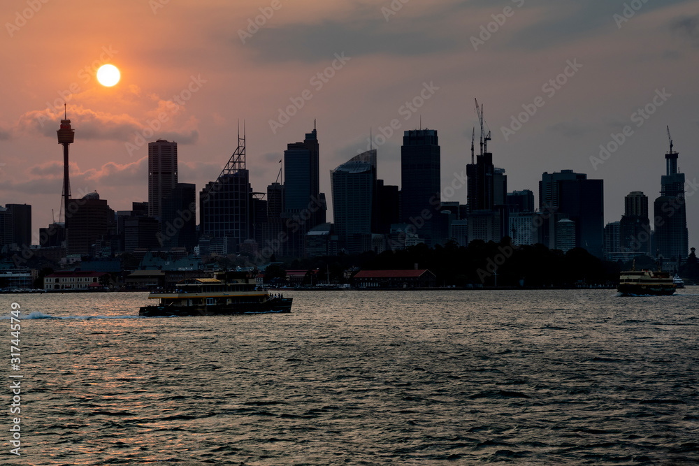 Ferries making their way across Sydney harbour at sunset Ferries making their way across Sydney harbour at sunset