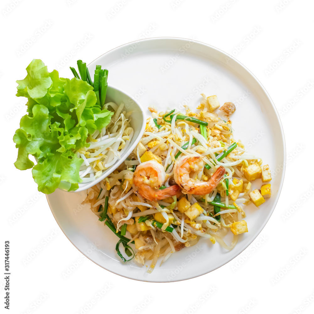 Fried noodles or Pad Thai with Fresh Shrimp, spring onions and tofu And lettuce, bean sprouts on a plate isolated white background. Top view Fried noodles or Pad Thai with Fresh Shrimp, spring onions and tofu And lettuce, bean sprouts on a plate isolated white background. Top view