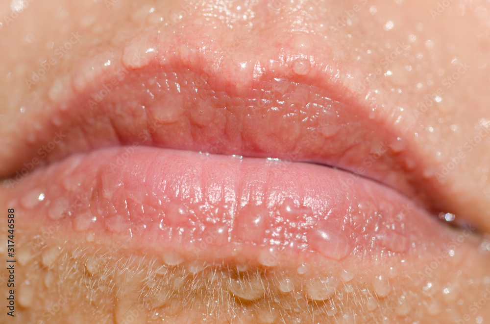 Fototapeta premium Lips on Mouth with Water Drops.