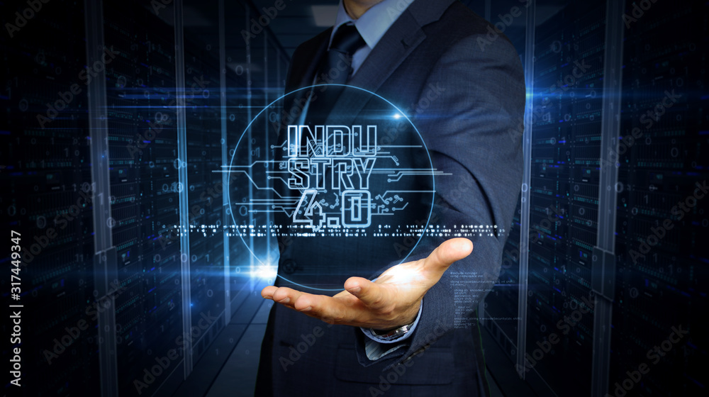 Businessman with industry 4.0 hologram Businessman with industry 4.0 hologram
