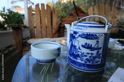 teapot and cup in garden table at China photo