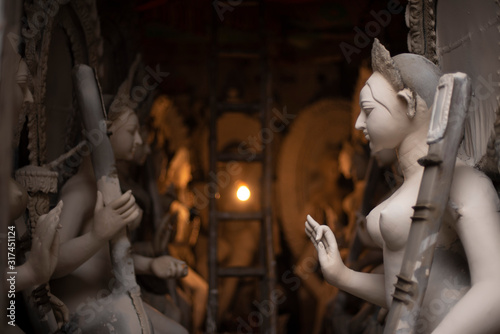Clay idols of Hindu Goddess Saraswati being made and displayed for the Indian Bengali festival in winter in Bengal. Indian culture and religion.