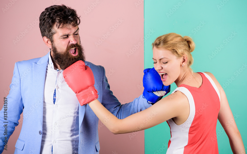 Be careful. problems in relationship. sport. bearded man hipster fighting with woman. knockout punching. who is right. win the fight. Strength and power. family couple boxing gloves Be careful. problems in relationship. sport. bearded man hipster fighting with woman. knockout punching. who is right. win the fight. Strength and power. family couple boxing gloves