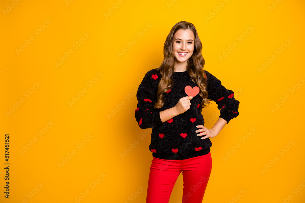 Photo of pretty curly lady amour holding little paper heart hear chest symbolizing cardiology health care wear hearts pattern sweater red trousers isolated yellow color background Photo of pretty curly lady amour holding little paper heart hear chest symbolizing cardiology health care wear hearts pattern sweater red trousers isolated yellow color background