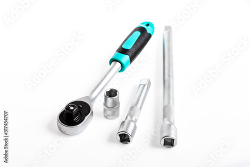 Tools for repair and construction. Main advantage of heads used to unwind or tighten nuts and bolts hard to reach places. Shop for ratchets and sockets in hand tools. Home improvement tools concept photo