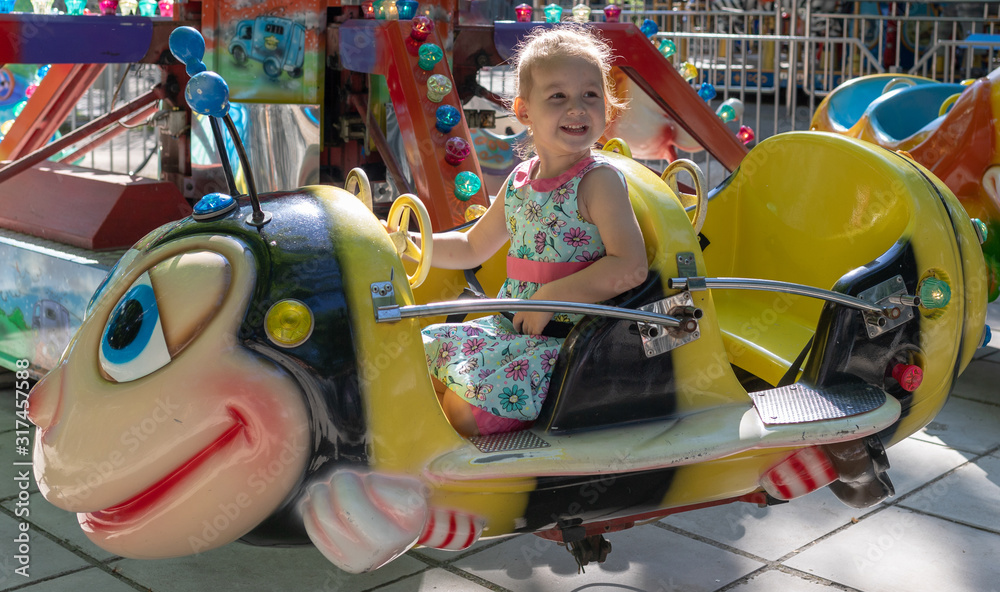 Child rides in an amusement park. children attractions