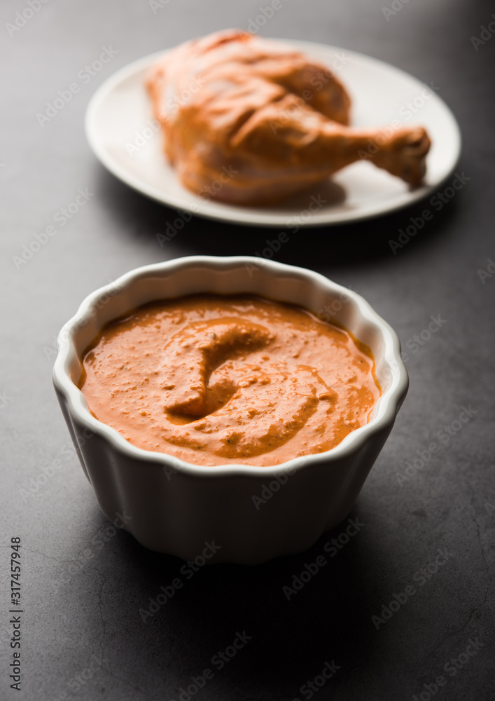 Homemade Tandoori Paste or Marinade mixture, in a bowl. used for grilled chicken or Paneer or vegetable. selective focus Homemade Tandoori Paste or Marinade mixture, in a bowl. used for grilled chicken or Paneer or vegetable. selective focus