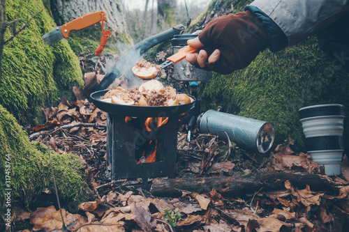 Cook on a hiking trip with a backpack.