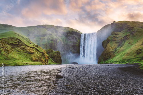 Famous Skogafoss waterfall on Skoga river in sunrise time. Iceland, Europe. Landscape photography photo