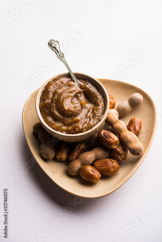 Dates Tamarind Chutney - Khajoor crushed to paste and mixed with Imli or imalee paste, served as a side dish in India photo