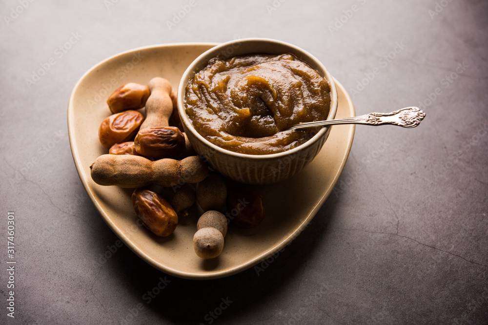 Fototapeta premium Dates Tamarind Chutney - Khajoor crushed to paste and mixed with Imli or imalee paste, served as a side dish in India