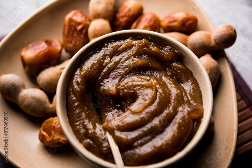 Dates Tamarind Chutney - Khajoor crushed to paste and mixed with Imli or imalee paste, served as a side dish in India photo