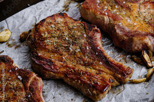 roasted pork loin with ribs on a wooden background