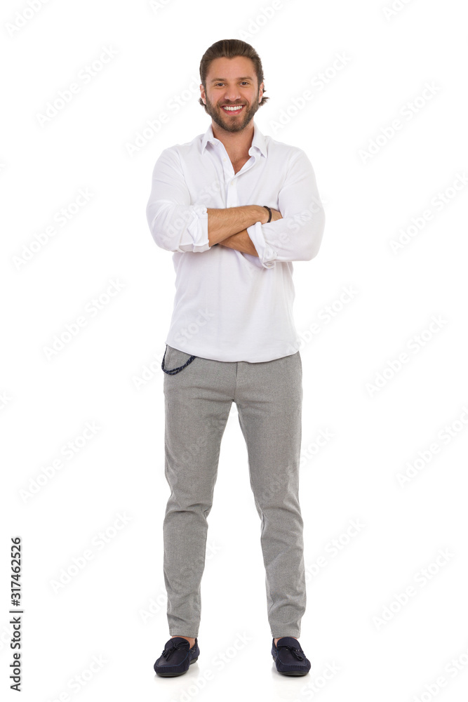 Confident Man Standing With Arms Crossed. Front View. Confident Man Standing With Arms Crossed. Front View.
