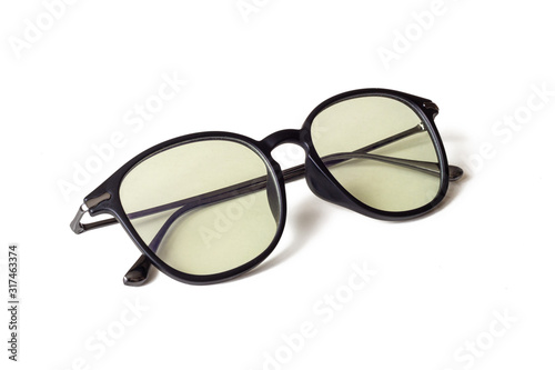 Sunglasses with light yellow UV lenses, on a white background