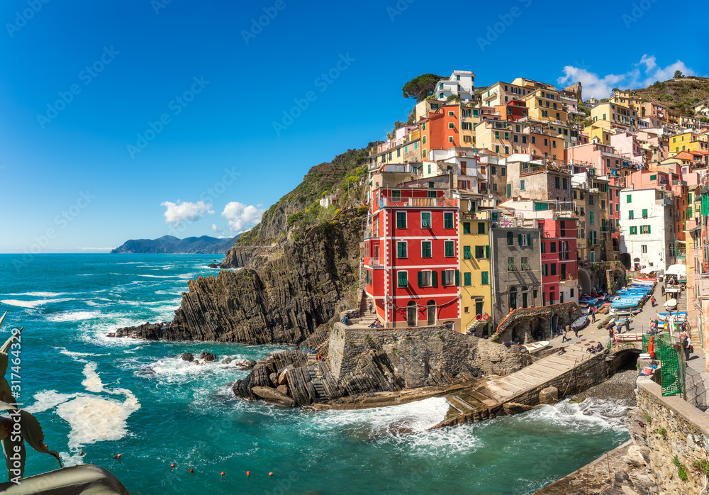 Beautiful view of Riomaggiore - one of five famous colorful villages of Cinque Terre National Park in Italy, Liguria region.