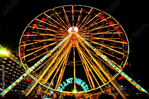 Giant Ferris Wheel,In the winter of Bangkok Games and amusement are organized in an empty courtyard along Rama 9 Road, Din Daeng District, Bangkok, Thailand, 23 November, 2019.