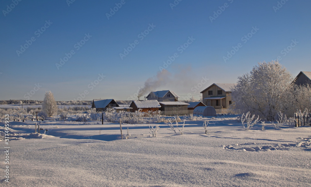 The wooden house with the household.buildings winter frosty day
