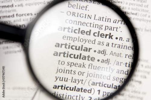 Fotografi Articular and articulate word or phrase in a dictionary.