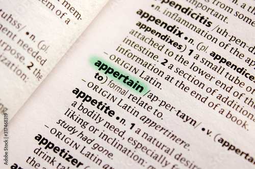 Appertain word or phrase in a dictionary.