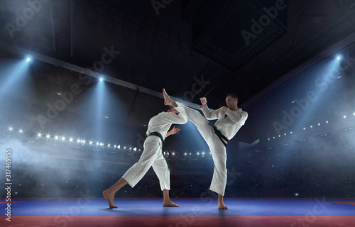 Karate fighters on tatami. Fighting Championship. © Victoria VIAR PRO