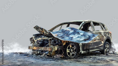 Burnt new car. Isolated on grey background.