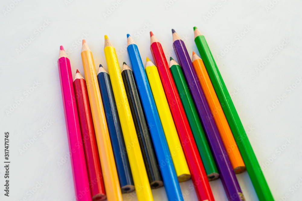 Coloured pencil pattern on white background. Colourful pencil seamless pattern. Coloured pencil pattern on white background. Colourful pencil seamless pattern.